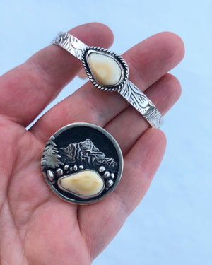 ‘Mountain Boulders’ Rifle Sling Buckle - handcrafted Elk Ivory in Sterling Silver by The Jewelry Shop, made in Arizona